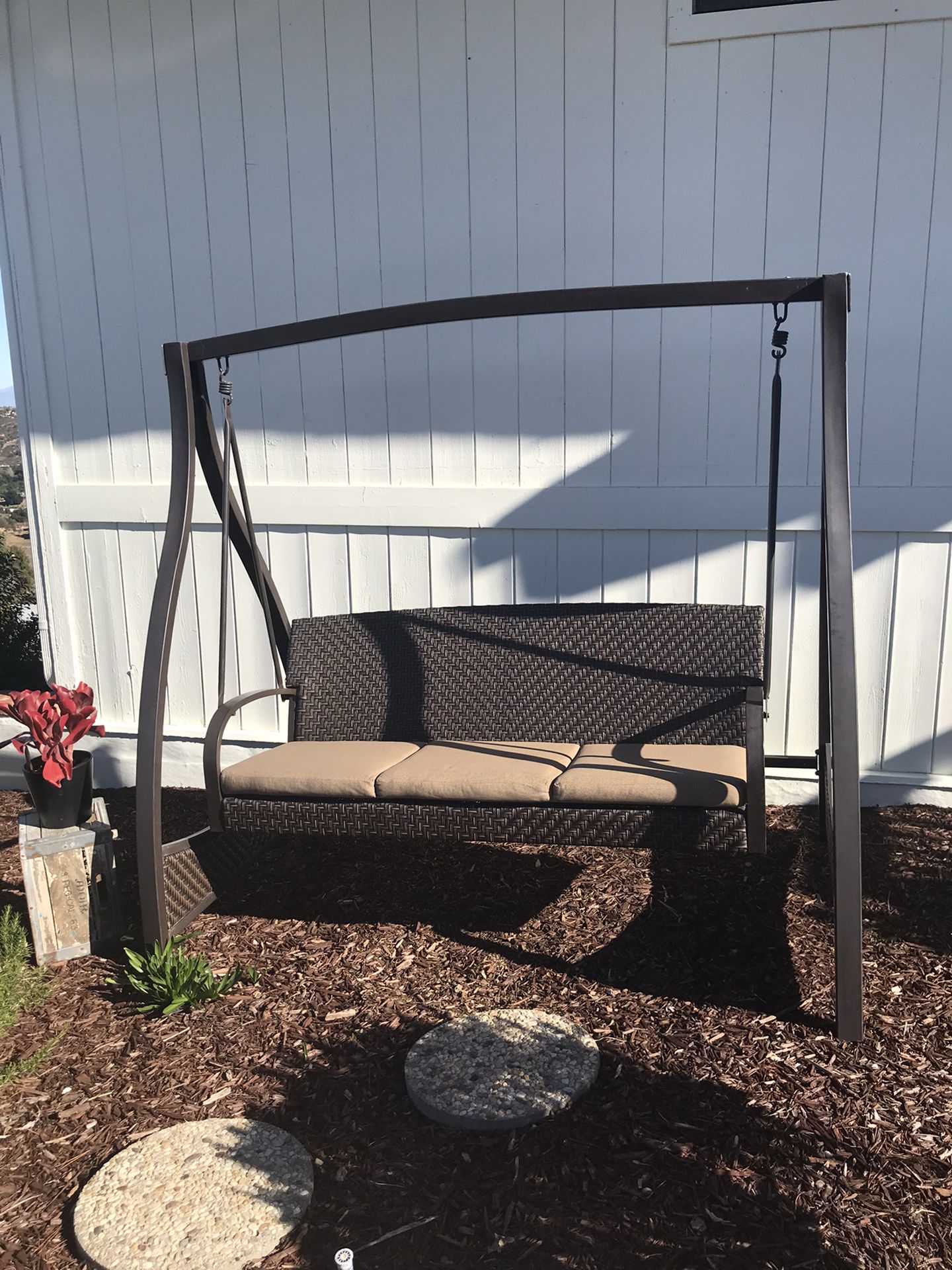 Outdoor porch swing with cushions