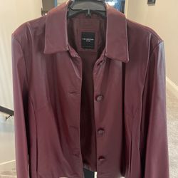 Ladies red leather medium jacket. Lightly worn. In excellent condition. 