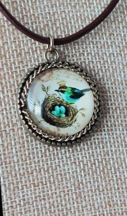 BIRD and NEST OF EGGS PENDANT on CORD NECKLACE