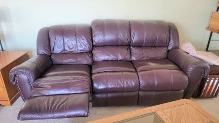 Leather Reclining Sofa with Nailhead Trim.  (WxDxH): 89x 38 x 40 in