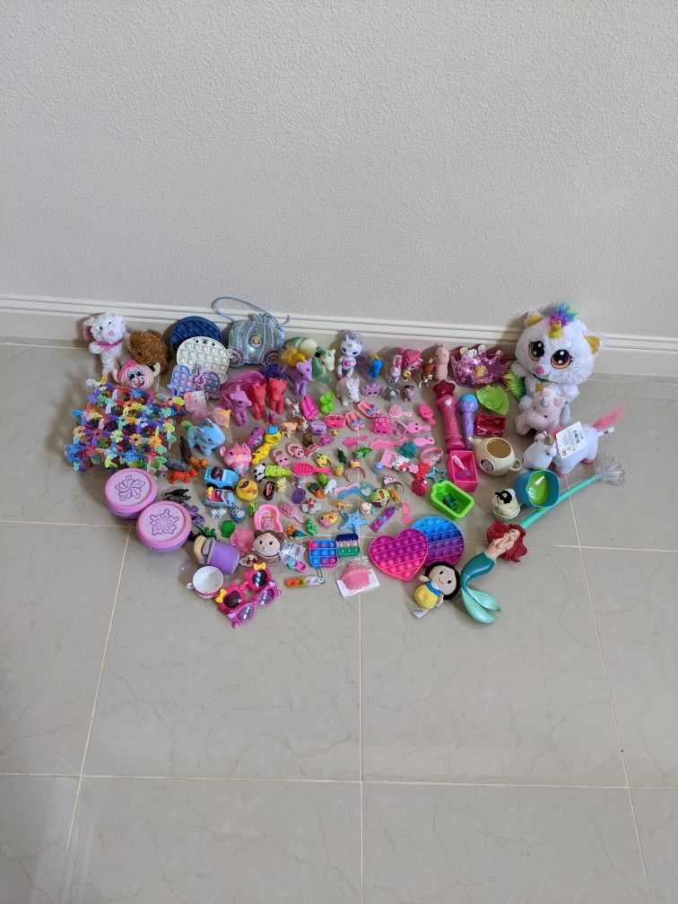 large collection of doll accessories and small toys