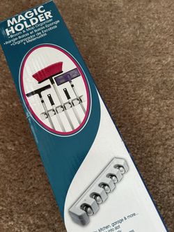 Magic holder. 5 slots Broom n mop holder. New in box. Never used