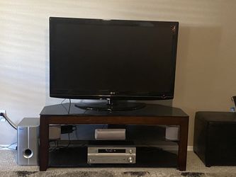 55inch TV, Stand with glass top and pioneer home theater system with surround sound. Sell separately or as bundle.