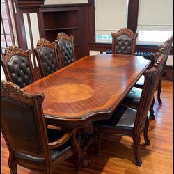 Wooden dining table and Leather Chairs