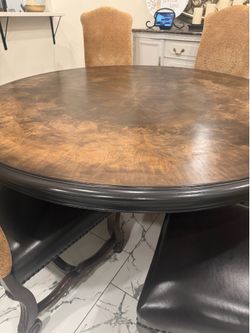 large, Very beautiful dining set with 6 leather chairs , the table measures  71 inches wide and 31 1/2
