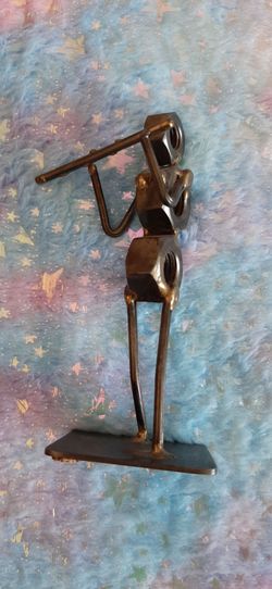 Metal scrap art flutist figurine