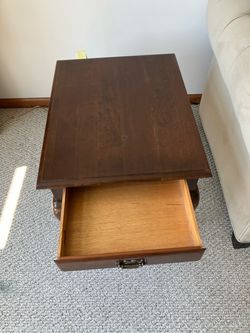 Dark Wood End Table with Drawer and table.