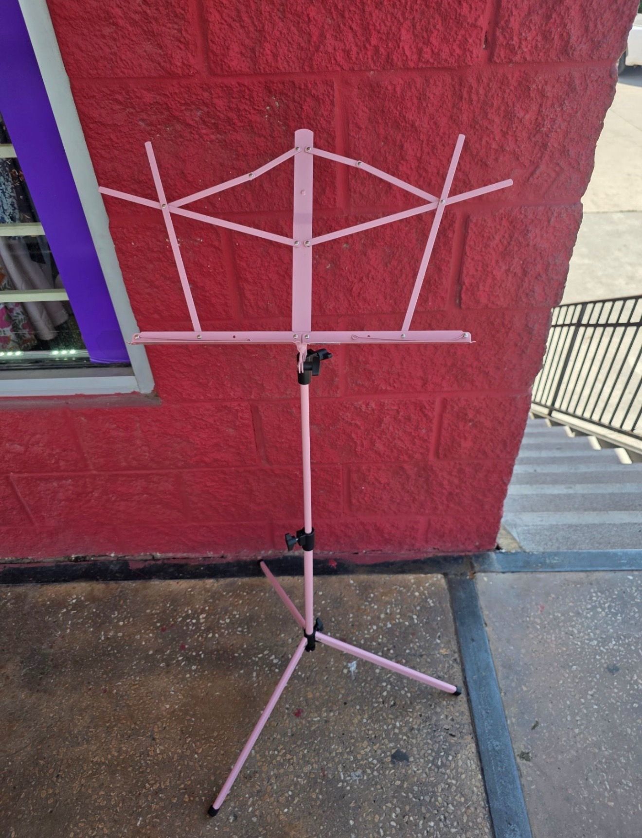 Like new collapsible pink music stand with carry pouch, $15
