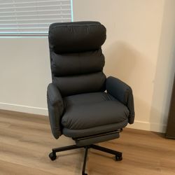 PU Leather Cross-legged Office Chair with Flip-up Arms and Headrest, Footrest and Side Pockets. Dark Grey