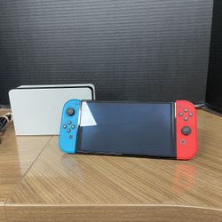 OLED Nintendo Switch 64gb with docking station no offers or trades please!!