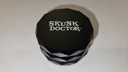 Skunk Doctor 4 Piece Herb Grinder Black Metal with Screen 2.5 Inch