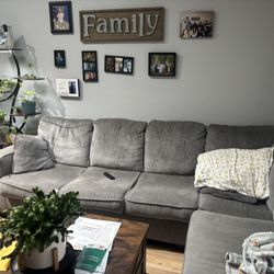 Grey L shaped couch with Hide a bed