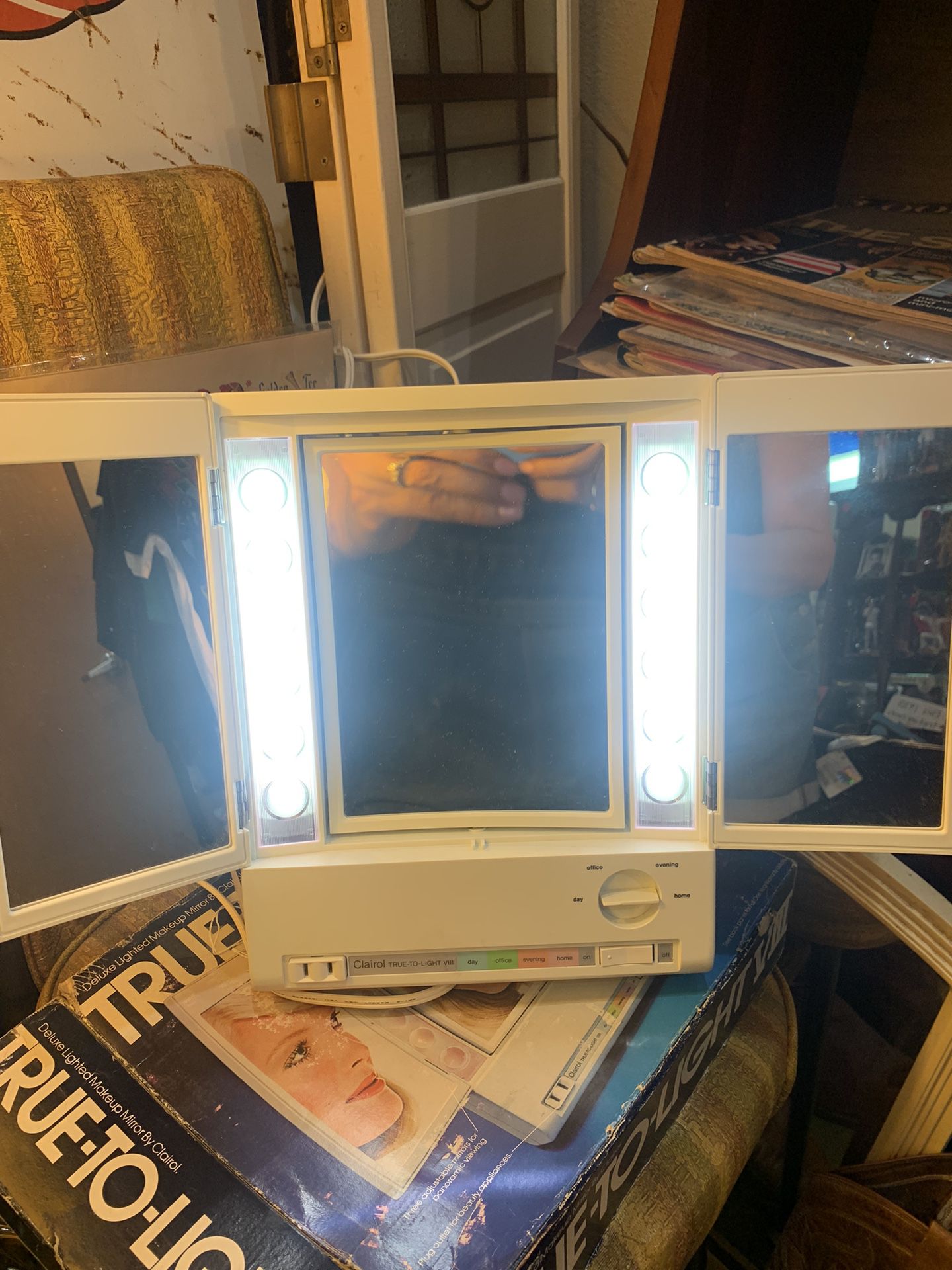 1970s 1980s standing vanity mirror. Magnifying mirror or normal with different lighting settings and swivel mirrors. Includes original box. 30.00.  Jo