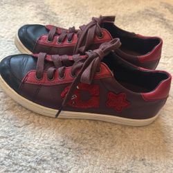 Title: COACH Burgundy Leather Star Patch Low-Top Sneakers Size [Insert Size]  Description: Authentic COACH low-top retro court sneakers crafted in sup