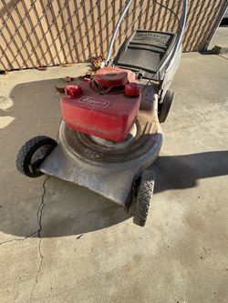 Used lawnmower,smokes, for parts