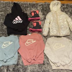 Variety Of Girls Clothes And Snow Boots