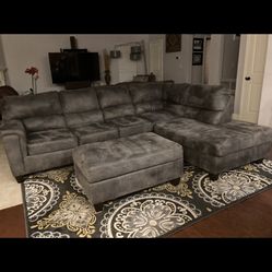 Beautiful Smoke Gray Three Piece Sectional With Storage ottoman