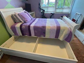 Twin Sleigh bed trundle with matching dresser and bookshelf.   set