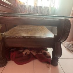 wooden coffee table with a beveled glass top