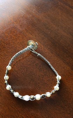 Signed Aero bracelet with silver string and charms