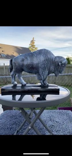 The old gray buffalo statue