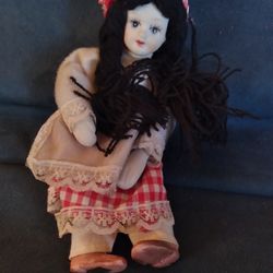 Vintage porcelain rag doll, In excellent condition, and is 5 in tall