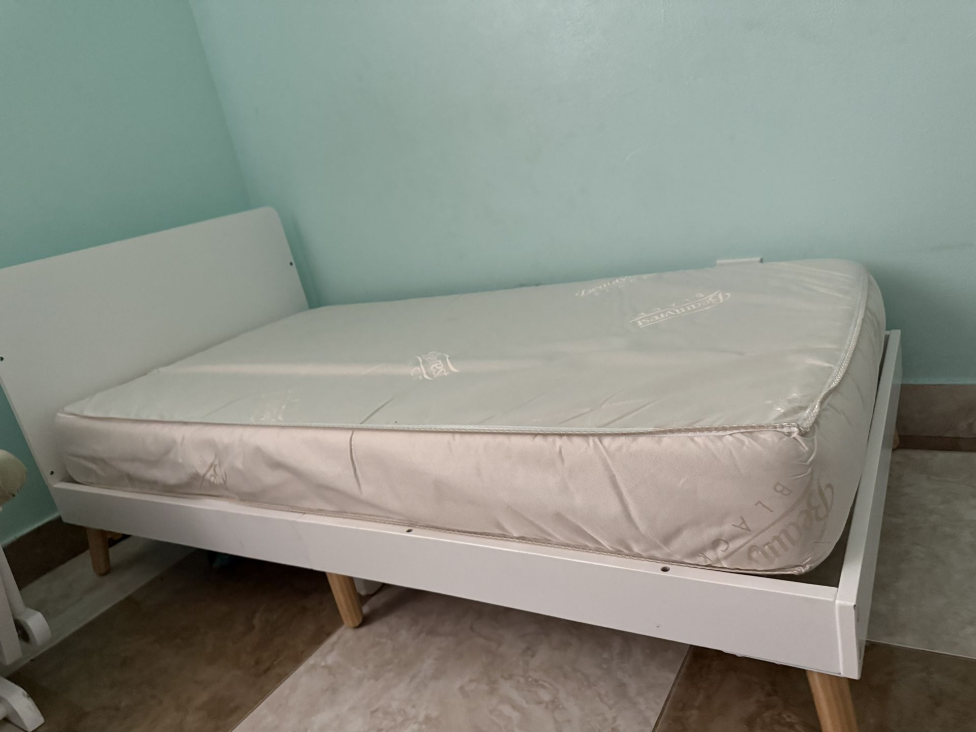 The Logan Wood Toddler Bed by Delta Children is a must-have bed