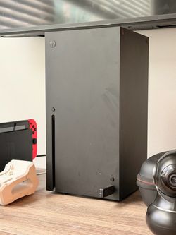 Microsoft Xbox Series X Console with controller and charging dock