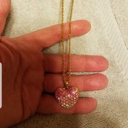 Avon Heart necklace gold plated with Pink Cubic Zirconia diamonds  
New/ old stock 

Please go to my page and see other items that I have listed thank