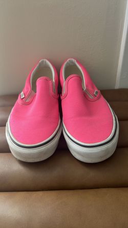 Vans Classic Slip-On sneakers in a neon pink color