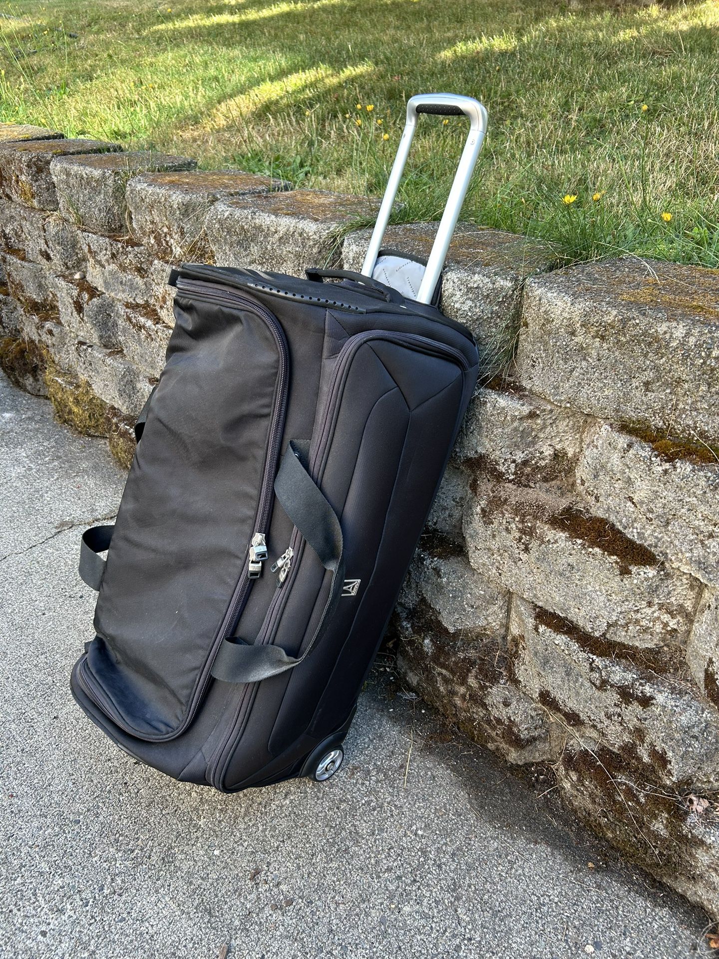 TravelPro Rolling Luggage - Like New