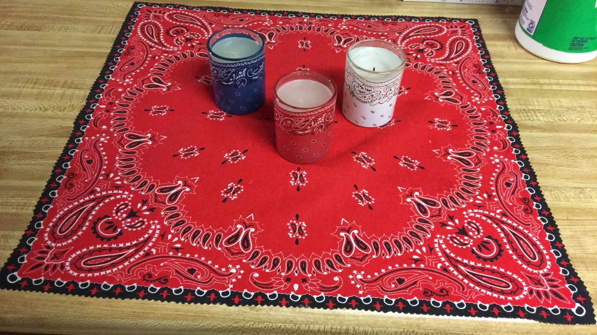 et of 1 red/white/black bandanna centerpiece Approximately 16x16 And 3 bandanna candles red, white, blue 3” high