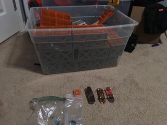 Tech deck ramps with 2 teck decks and a remote controll skate board with screwdriver and 3 extra sets of trucks