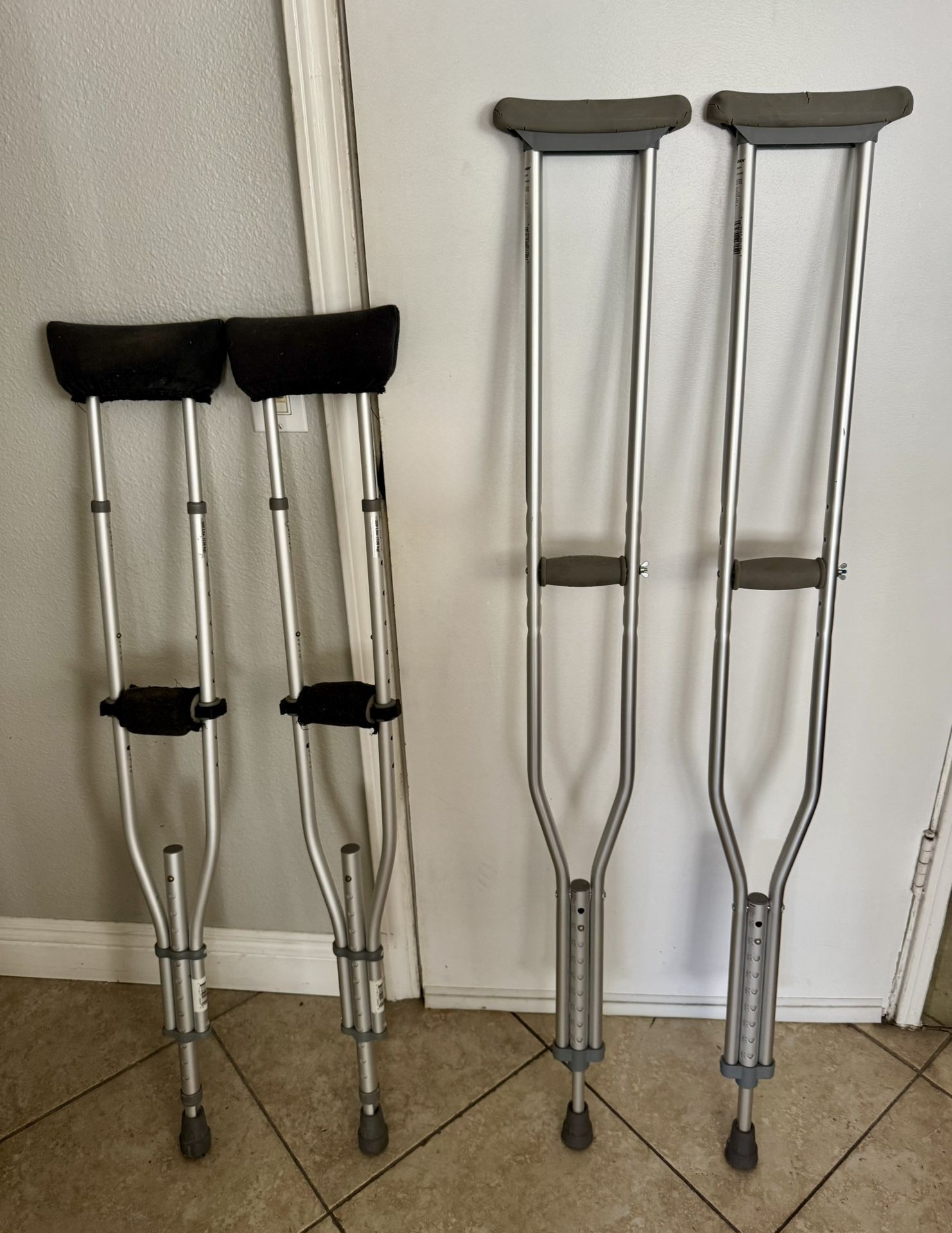 Two pairs of underarm  crutches