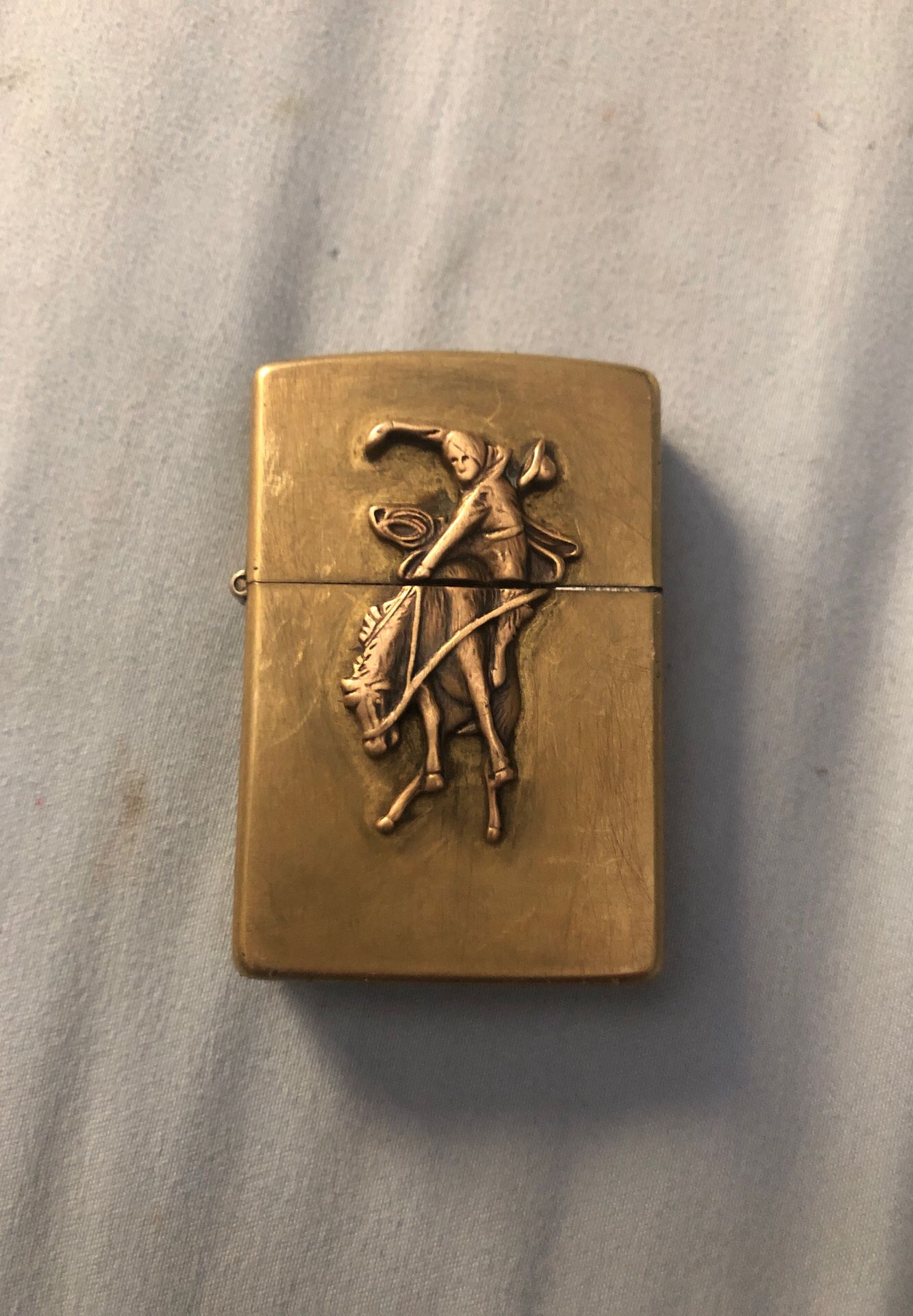 Zippo with horse and horseman, brass colored
