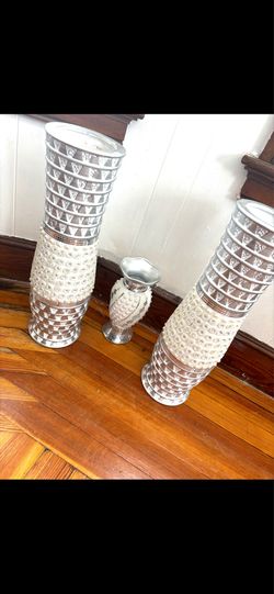 Two tall vases one small