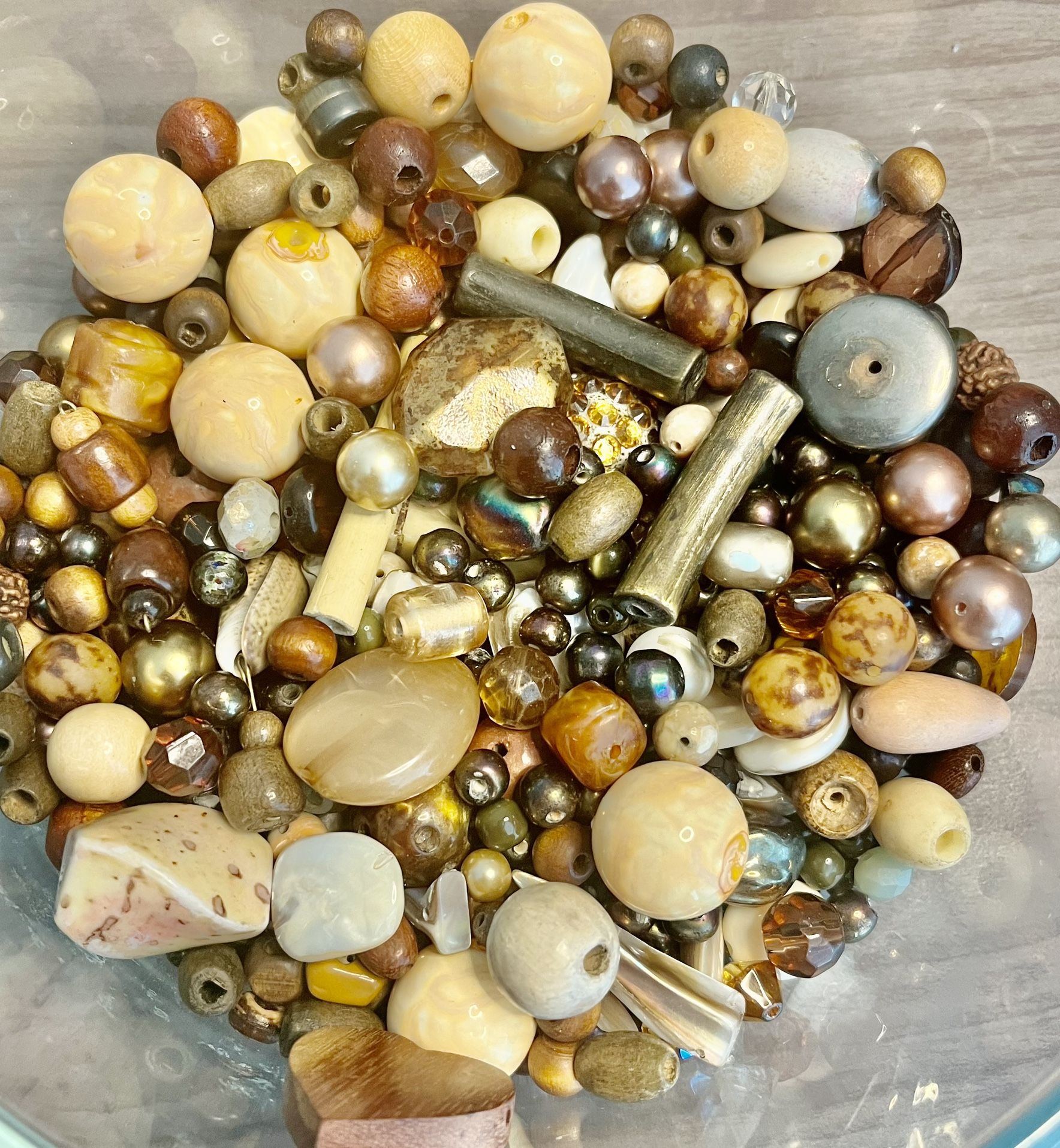 Vintage brown and tan beads. All different shades of brown and and sizes. As is. No returns. Make me an offer I can’t refuse. Please feel free to co