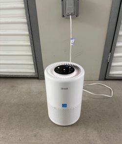 Levoit Core 200S Smart Air Purifier featuring top-mounted touch controls and a cylindrical design.