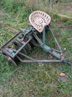 Disc harrow with seat.
