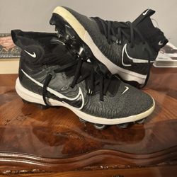 Nike Alpha Huarache NXT MCS men's baseball cleats in black with white accents. 