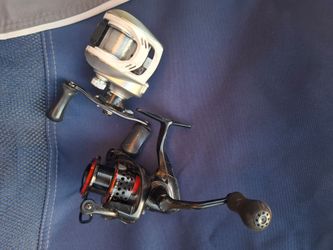 2 okuma fishing reels one bait caster one spin action