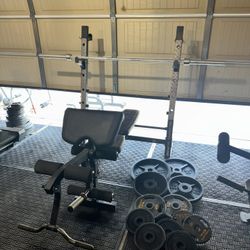 Bench press/squat rack with 7ft 45lbs bar plus 270lbs of Olympic weights