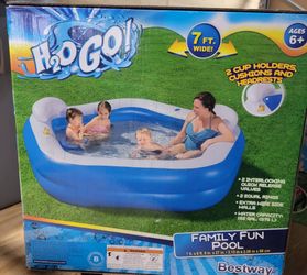 Family Fun Pool with Cup Holders, Seats and Cushion Head Rests $50 (One Available)