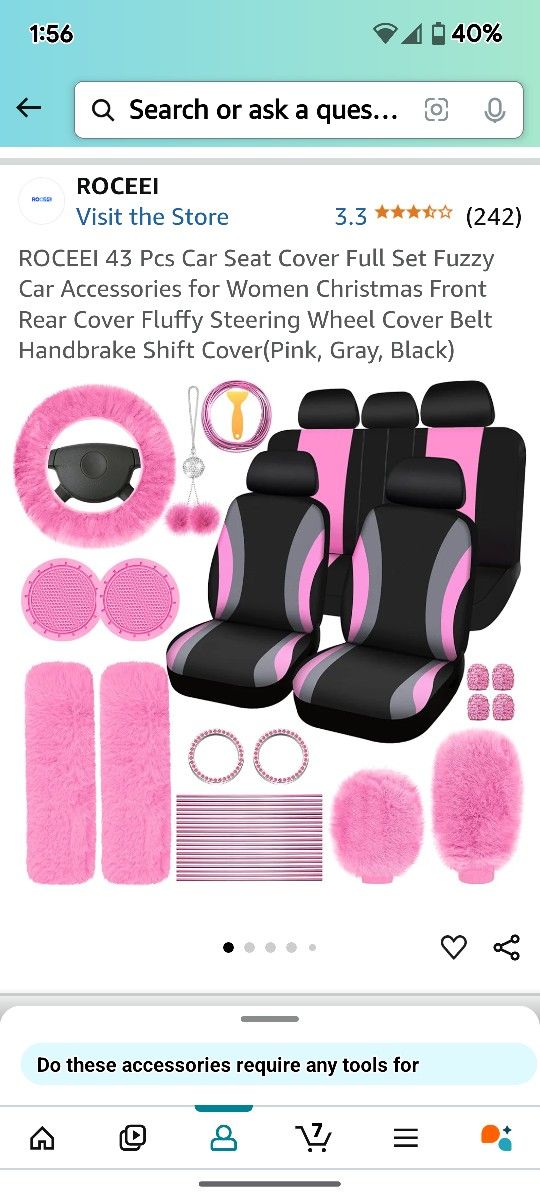 CAR SEAT COVERS WITH PINK ACCESSORIES.
