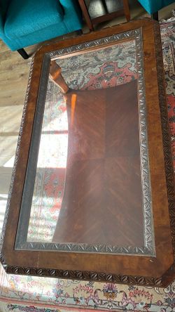 Glass Top Coffee Table With Detail Carving and Base