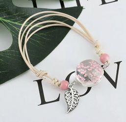Pink baby’s breath in glass bracelet