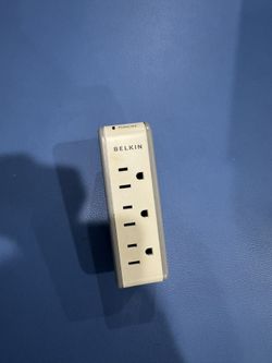 Compact Belkin surge protector with three outlets and two USB ports