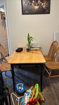 Brown kitchen table with four chairs
