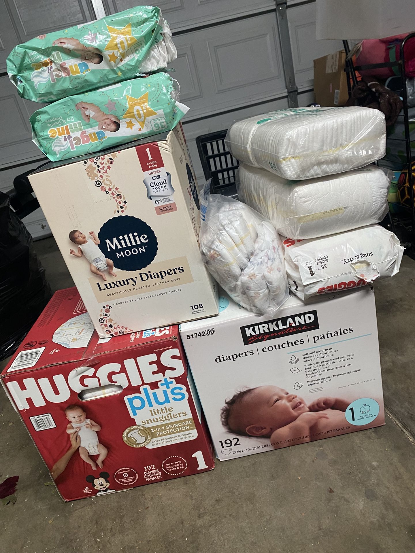 Diapers size 1 and two small packs of size 0