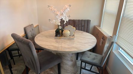 Round  marble looking table with 4 gray velvet chairs